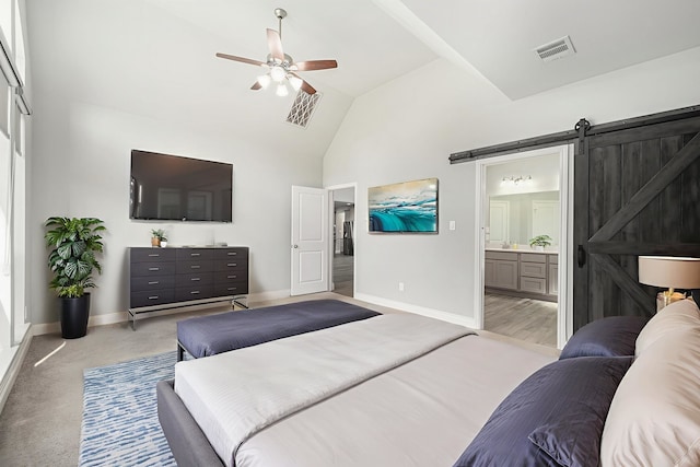 28702 Casen Ranch Ln, Fulshear, TX 77441 - bedroom with high vaulted ceiling, a barn door, ensuite bath, and ceiling fan