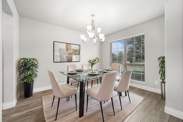 28702 Casen Ranch Ln, Fulshear, TX 77441 - dining room with a chandelier and wood finished floors