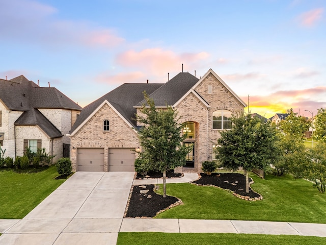 28702 Casen Ranch Ln, Fulshear, TX 77441 - french country home with concrete driveway, brick siding, and a yard