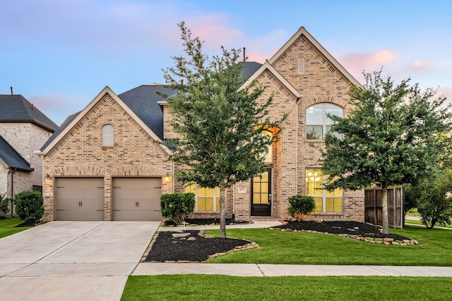 28702 Casen Ranch Ln, Fulshear, TX 77441 - view of front of property with brick siding, driveway, and a yard