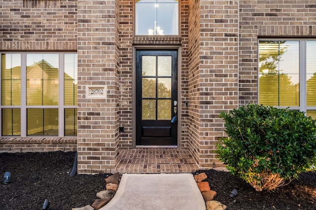 28702 Casen Ranch Ln, Fulshear, TX 77441 - doorway to property with brick siding