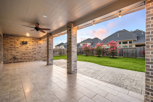 28702 Casen Ranch Ln, Fulshear, TX 77441 - fenced backyard featuring a ceiling fan and a patio