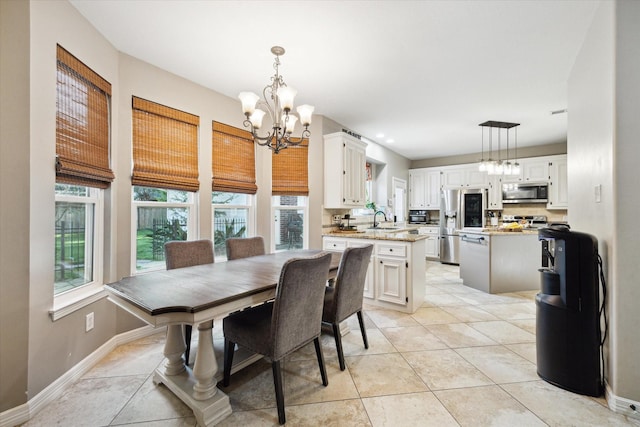 12511 Wealdstone Dr, Tomball, TX 77377 - dining area featuring a chandelier and light tile patterned flooring