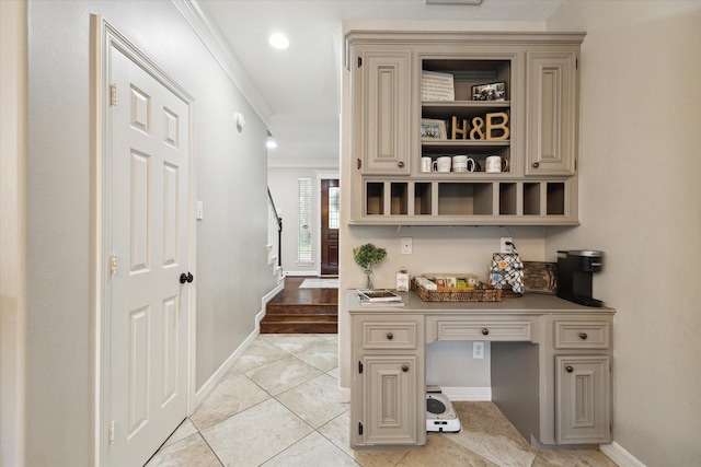 12511 Wealdstone Dr, Tomball, TX 77377 - office with ornamental molding, built in desk, and light tile patterned floors
