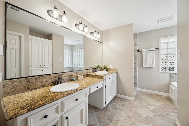 12511 Wealdstone Dr, Tomball, TX 77377 - full bathroom featuring double vanity, a stall shower, and a garden tub
