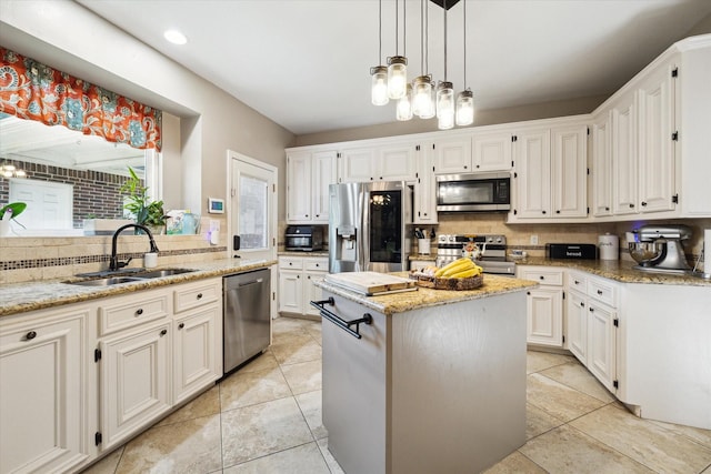 12511 Wealdstone Dr, Tomball, TX 77377 - kitchen with stainless steel appliances, light stone countertops, backsplash, and a center island
