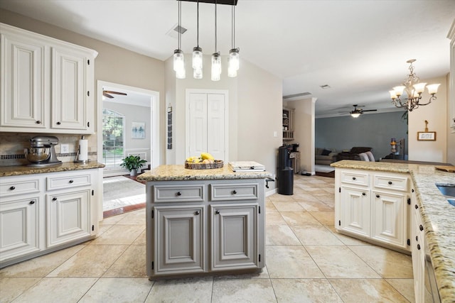 12511 Wealdstone Dr, Tomball, TX 77377 - kitchen with ceiling fan, open floor plan, pendant lighting, and light tile patterned flooring