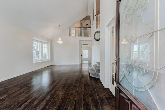 13351 Arlon Trl, Houston, TX 77082 - entrance foyer with dark wood finished floors, stairway, high vaulted ceiling, and arched walkways
