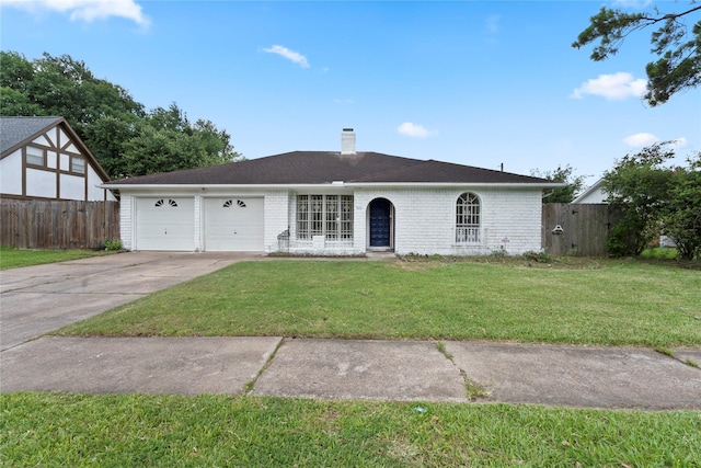 7019 Pyron Way, Houston, TX 77036 - view of front of home featuring a garage, a chimney, and concrete driveway