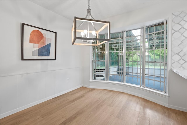 7019 Pyron Way, Houston, TX 77036 - unfurnished dining area with a chandelier and wood finished floors