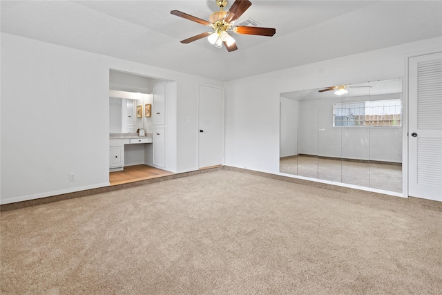 7019 Pyron Way, Houston, TX 77036 - unfurnished living room with ceiling fan and carpet flooring