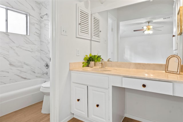 7019 Pyron Way, Houston, TX 77036 - full bath featuring vanity, a ceiling fan, shower / bathtub combination, and wood finished floors