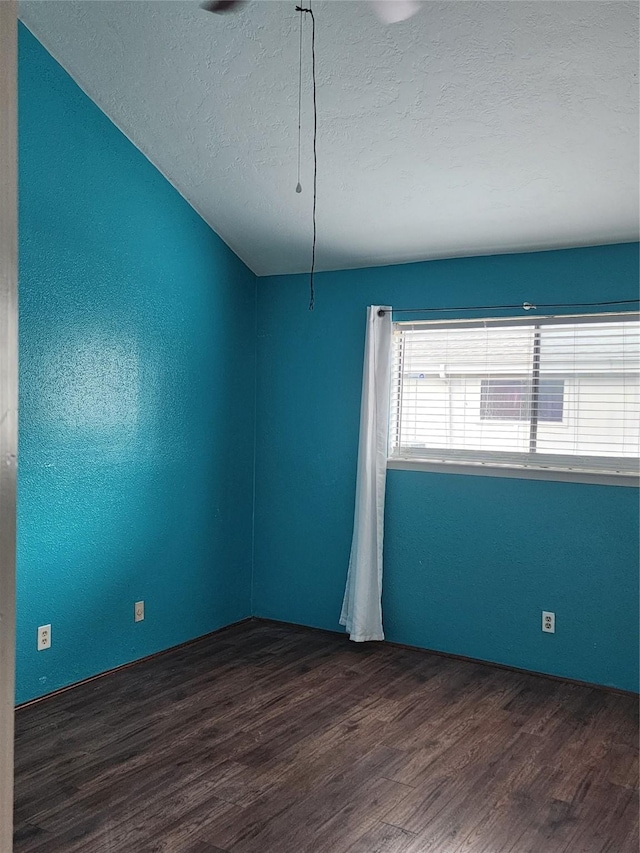 10811 Richmond Ave Unit 40, Houston, TX 77042 - unfurnished room with dark wood finished floors and a textured ceiling