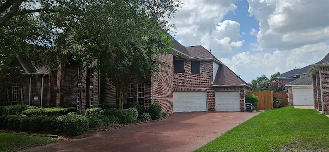 5322 Norborne Ln, Houston, TX 77069 - traditional home featuring brick siding, driveway, and a garage