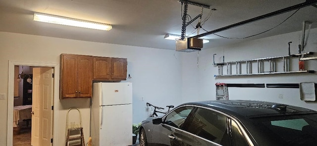 5322 Norborne Ln, Houston, TX 77069 - garage featuring freestanding refrigerator and a garage door opener