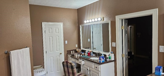 5322 Norborne Ln, Houston, TX 77069 - bathroom with a textured wall and vanity