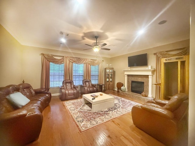 5322 Norborne Ln, Houston, TX 77069 - living area featuring ceiling fan, wood finished floors, and a high end fireplace