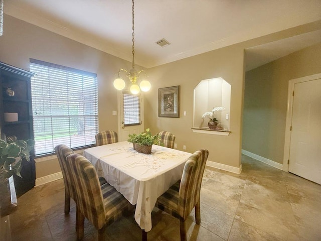 5322 Norborne Ln, Houston, TX 77069 - dining room featuring a chandelier, ornamental molding, and light tile patterned floors