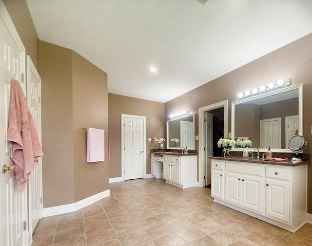 5322 Norborne Ln, Houston, TX 77069 - full bathroom featuring two vanities and tile patterned flooring