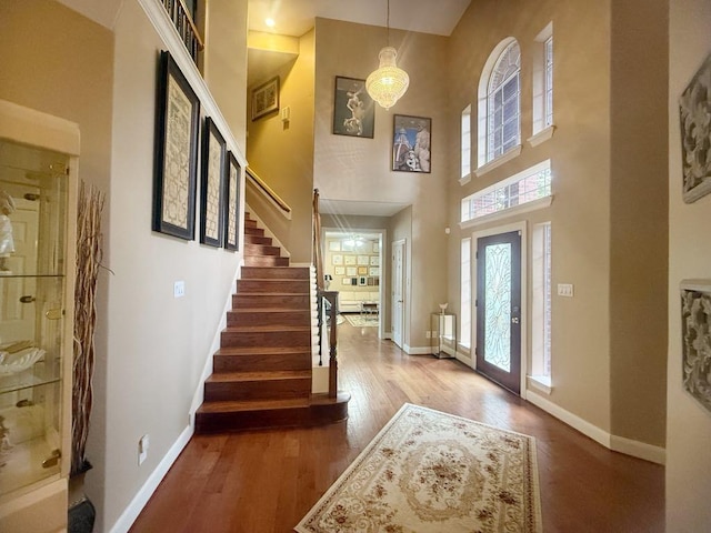 5322 Norborne Ln, Houston, TX 77069 - entryway featuring a towering ceiling, wood finished floors, and stairs