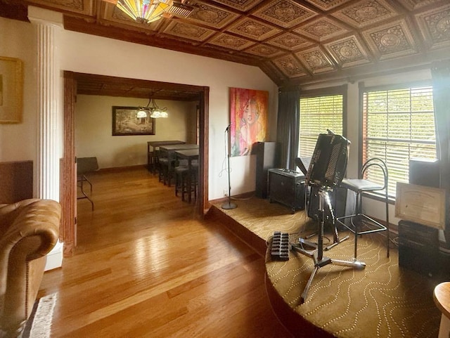 5322 Norborne Ln, Houston, TX 77069 - office area featuring an ornate ceiling, wood finished floors, and a chandelier