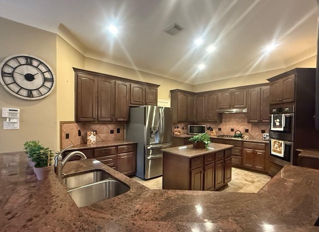 5322 Norborne Ln, Houston, TX 77069 - kitchen with stainless steel appliances, tasteful backsplash, and stone countertops