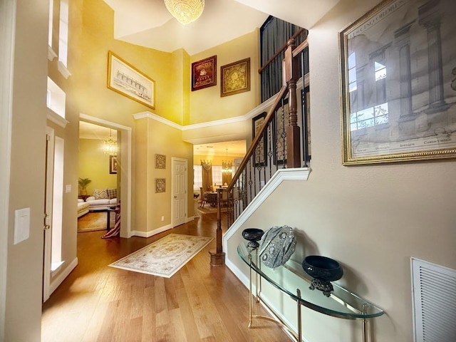 5322 Norborne Ln, Houston, TX 77069 - entrance foyer featuring a high ceiling, stairs, wood finished floors, and a chandelier