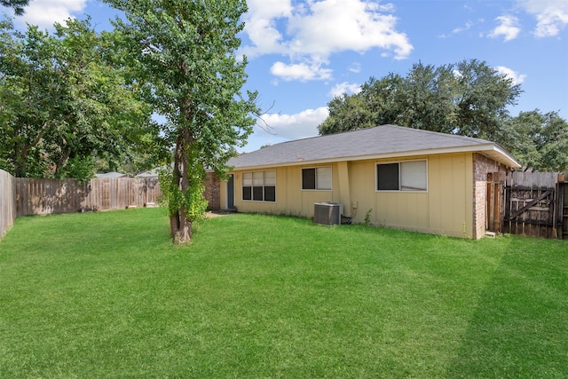 14138 Rosetta Dr, Cypress, TX 77429 - rear view of property with a fenced backyard and board and batten siding