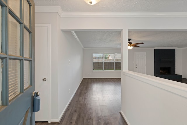 14138 Rosetta Dr, Cypress, TX 77429 - hallway featuring a textured ceiling, dark wood-style flooring, and crown molding