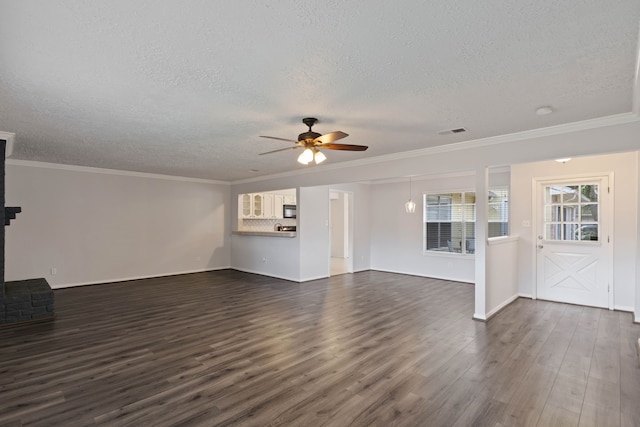14138 Rosetta Dr, Cypress, TX 77429 - unfurnished living room featuring a textured ceiling, ceiling fan, dark wood-type flooring, and ornamental molding