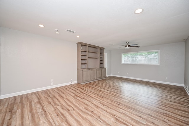 5906 Dumfries Dr, Houston, TX 77096 - unfurnished living room with ceiling fan, light wood-style flooring, and recessed lighting