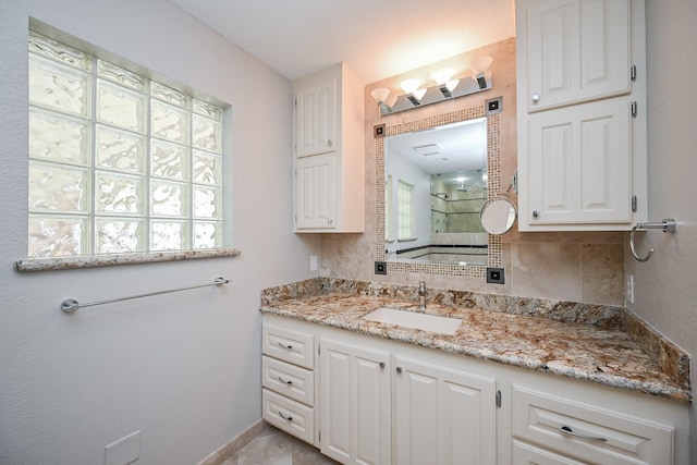 5906 Dumfries Dr, Houston, TX 77096 - full bathroom with vanity, tiled shower, and backsplash