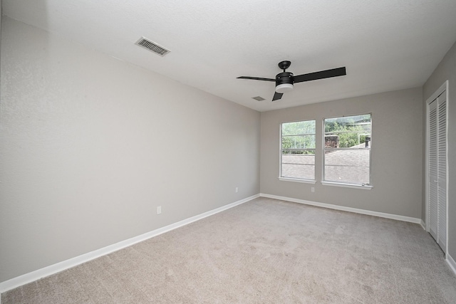 5906 Dumfries Dr, Houston, TX 77096 - unfurnished bedroom with a closet, light colored carpet, and ceiling fan