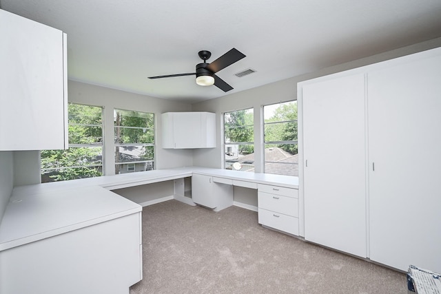 5906 Dumfries Dr, Houston, TX 77096 - unfurnished office featuring built in desk, light colored carpet, and a ceiling fan