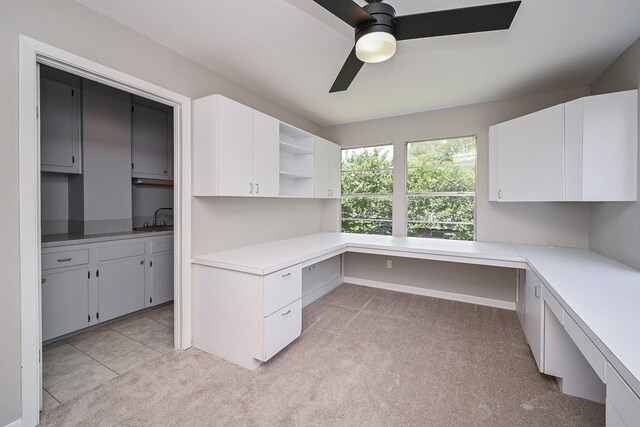 5906 Dumfries Dr, Houston, TX 77096 - unfurnished office with built in desk, ceiling fan, and light colored carpet