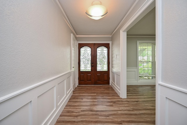 5906 Dumfries Dr, Houston, TX 77096 - entrance foyer with a decorative wall, dark wood-style floors, crown molding, french doors, and a wainscoted wall