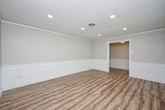 5906 Dumfries Dr, Houston, TX 77096 - spare room with ornamental molding, recessed lighting, wood finished floors, a wainscoted wall, and a decorative wall