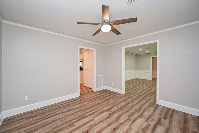 5906 Dumfries Dr, Houston, TX 77096 - empty room featuring ceiling fan, wood finished floors, and crown molding