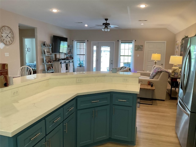 19 Trail Lk, Trinity, TX 75862 - kitchen featuring green cabinetry, freestanding refrigerator, open floor plan, light wood-type flooring, and ceiling fan