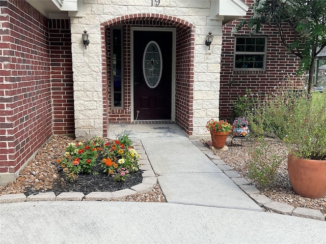 19 Trail Lk, Trinity, TX 75862 - view of exterior entry with stone siding and brick siding