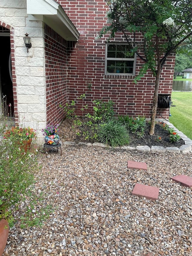 19 Trail Lk, Trinity, TX 75862 - view of side of property featuring brick siding