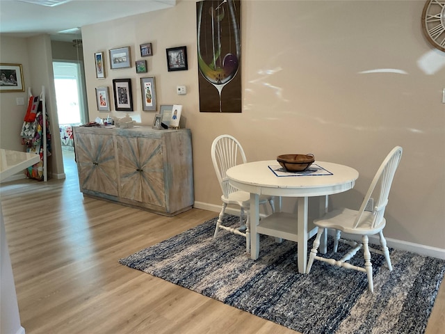 19 Trail Lk, Trinity, TX 75862 - dining area featuring wood finished floors and baseboards
