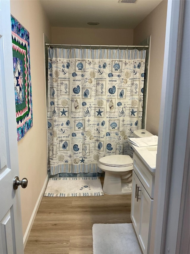 19 Trail Lk, Trinity, TX 75862 - full bathroom featuring wood finished floors, vanity, and a shower with curtain