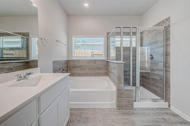 27072 Badger Way, Magnolia, TX 77354 - full bath with a bath, a stall shower, and vanity
