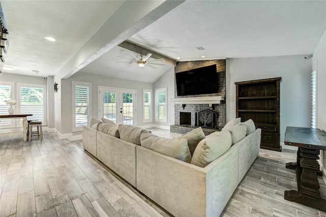1904 Nursery Rd, The Woodlands, TX 77380 - living room featuring light wood finished floors, a ceiling fan, healthy amount of natural light, a brick fireplace, and recessed lighting