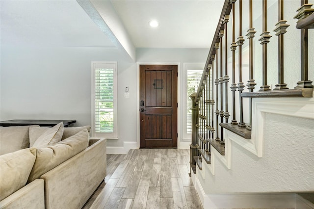 1904 Nursery Rd, The Woodlands, TX 77380 - entrance foyer featuring light wood-type flooring, stairs, and recessed lighting