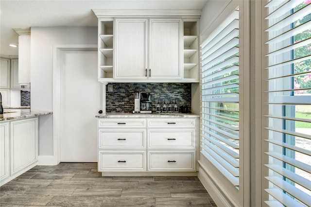 1904 Nursery Rd, The Woodlands, TX 77380 - kitchen featuring open shelves, tasteful backsplash, light stone counters, white cabinets, and recessed lighting