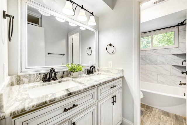 1904 Nursery Rd, The Woodlands, TX 77380 - full bath featuring double vanity, wood finished floors, and shower / washtub combination