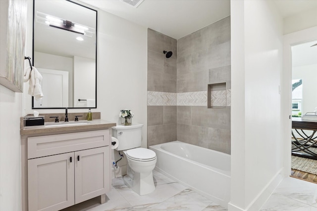 805 English St, Houston, TX 77009 - full bathroom with marble look tiles, vanity, and bathing tub / shower combination