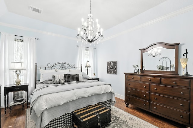 14506 Heron Marsh Dr, Cypress, TX 77429 - bedroom with a chandelier, a raised ceiling, dark wood-style flooring, and ornamental molding